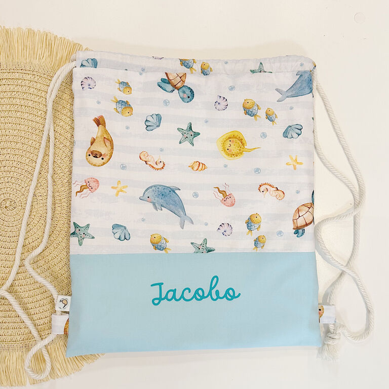 Mochila saco infantil con cuerdas de tela peces y rayas y verde agua