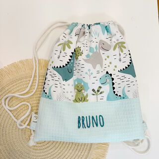 Mochila saco infantil con cuerdas de tela happy dinos y gofre mint